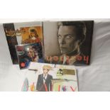 A lot of three David Bowie album and a sealed coloured vinyl 45