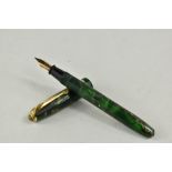 A Conway Stewart Dinkie 550 lever fill fountain pen in green marble with single band to the cap
