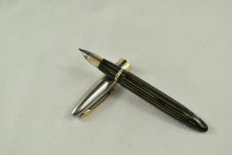 A Sheaffer Triumph Sentinel Deluxe Vac fill fountain pen in green stiated with steel cap having gold