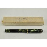 A Conway Stewart Dinkie 560 lever fill fountain pen in blue marble with gold veining having single