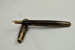 A Parker Vacumatic fountain pen in brown with broad decorative band to the cap having Parker
