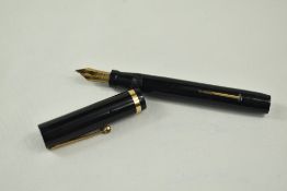 A Sheaffer Lifetime Flat Top lever fill fountain pen in black with single broad band and white