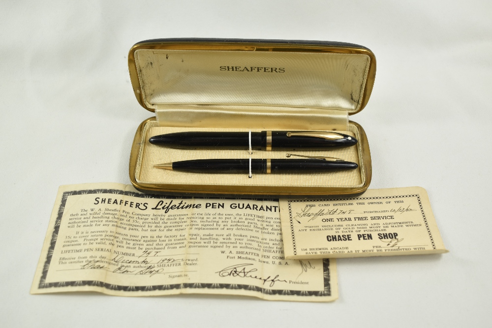 A Sheaffer Balance Lifetime lever fill fountain pen and propelling pencil set in black with single