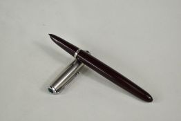 A Parker 51 aeromatic fill fountain pen in dark burgundy with lustiloy cap. Approx 13.8cm in very