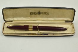 A Sheaffer Statesman Snorkel fountain pen in burgundy with broad band to the cap and white spot