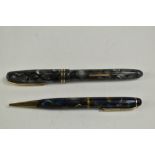 A Burnham B59 lever fill fountain pen in grey marble with three narrow bands to the cap having