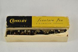 A boxed Croxley lever fill fountain pen in black grey marble with single narrow band to cap having