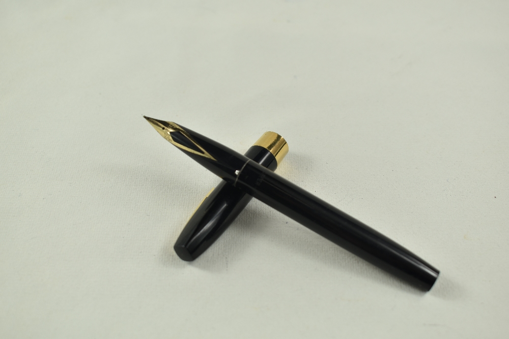 A Sheaffer Imperial cartridge/converter fountain pen in black having broad band to cap and white