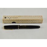 A boxed Parker Vacumatic plunger fill fountain pen in black with transparent barrel having two