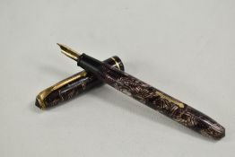A Conway Stewart Relief 12 lever fill fountain pen in pink grey hatch with single band to the cap