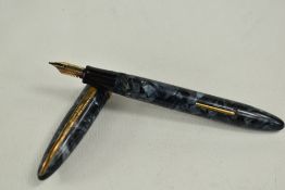 A Mentmore Paramount lever fill fountain pen in grey marble with knerled broad band to cap having
