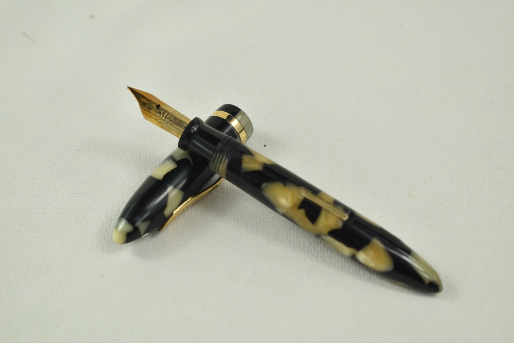 A Sheaffer Balance Lifetime petite lever fill fountain pen in black/pearl with single band and white