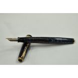 A Parker Vacumatic fountain pen in dark and pale blue having a broad ribbed band to the cap and blue