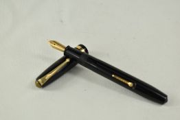 A Conway Stewart 84 lever fill fountain pen in black with single broad band to the cap having Conway