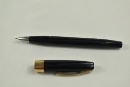 A Sheaffer Imperial Touchdown plunger fill fountain pen in black having broad band to cap and