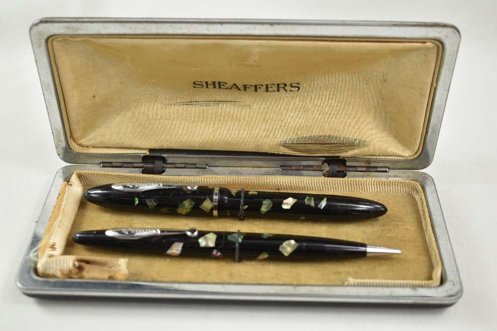 A Sheaffer Balance Junior lever fill fountain pen and propelling pencil set in black/ablone with