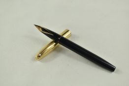 A Sheaffer Imperial cartridge/converter fountain pen in black having gold filled cap and white