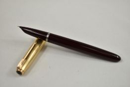 A Parker 51 aeromatic fill fountain pen in burgundy with gold filled cap. Approx 13.9cm in very good