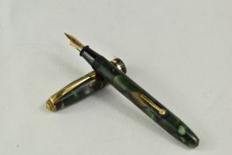 A Conway Stewart Dinkie 550 lever fill fountain pen in green brown marble with single band to the