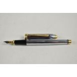A Cross Townsend converter fountain pen in chrome and gold having Cross nib. Approx 14.9cm very good