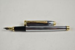 A Cross Townsend converter fountain pen in chrome and gold having Cross nib. Approx 14.9cm very good