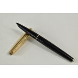 A Parker 61 converter fountain pen in black having rolled gold cap. Approx 13.4cm arrow above nib