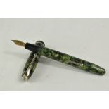 A Conway Stewart 75 lever fill fountain pen in green marble with single band to the cap having