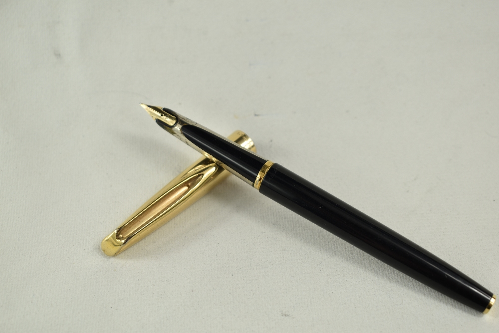A Waterman Converter Fill fountain pen in black with with rolled gold cap having 14ct nib. Good