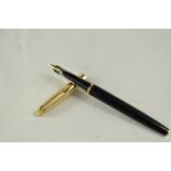 A Waterman Converter Fill fountain pen in black with with rolled gold cap having 14ct nib. Good