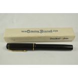 A boxed Conway Stewart 286 lever fill fountain pen in black with a narrow bands to the cap having