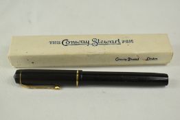A boxed Conway Stewart 286 lever fill fountain pen in black with a narrow bands to the cap having