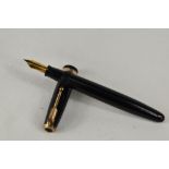 A Parker Duofold pump fill fountain pen in black, having decorative broad band to the cap having