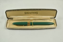 A Sheaffer Statesman Snorkel fountain pen in green with broad band to the cap and white spot