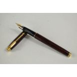 A Parker 75 converter fountain pen in thuya brown having Parker gold nib. Approx 12.8cm in very good