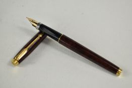 A Parker 75 converter fountain pen in thuya brown having Parker gold nib. Approx 12.8cm in very good