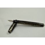 A Parker Vacumatic fountain pen with three narrow to the cap having Parker Vacumatic nib. Approx