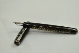 A Parker Vacumatic fountain pen with three narrow to the cap having Parker Vacumatic nib. Approx