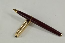 A Parker 65 aeromatic fountain pen in burgundy having rolled gold cap with Parker 14k nib. Approx