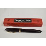A boxed Mabie Todd & Co Swan leverless 4230 twist fill fountain pen in black with one broad and