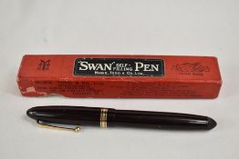 A boxed Mabie Todd & Co Swan leverless 4230 twist fill fountain pen in black with one broad and