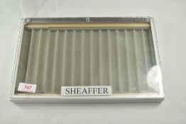A hard pen display case marked Sheaffer