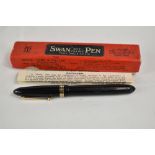 A boxed Mabie Todd & Co Swan leverless 4261 twist fill fountain pen in black with one broad and