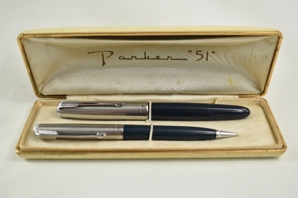 A boxed Parker 51 demi vacu fill fountain pen and propelling pencil set in black with lustiloy