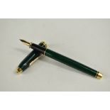 A Cross Townsend converter fountain pen in jade green marble having Cross nib. Approx 14.9cm very