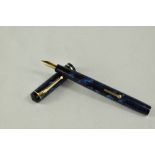 A Conway Stewart 476 lever fill fountain pen in blue black marble with a narrow bands to the cap