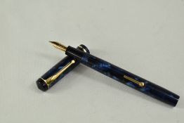 A Conway Stewart 476 lever fill fountain pen in blue black marble with a narrow bands to the cap