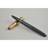 A Parker 51 vacu fill fountain pen in grey with gold filled cap having diamond to gold clip.