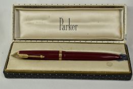 A boxed Parker Duofold Maxima aeromatic fill fountain pen in red, having broad decorative band to