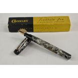 A boxed Croxley lever fill fountain pen in grey marble with single narrow band to cap having