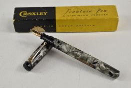 A boxed Croxley lever fill fountain pen in grey marble with single narrow band to cap having